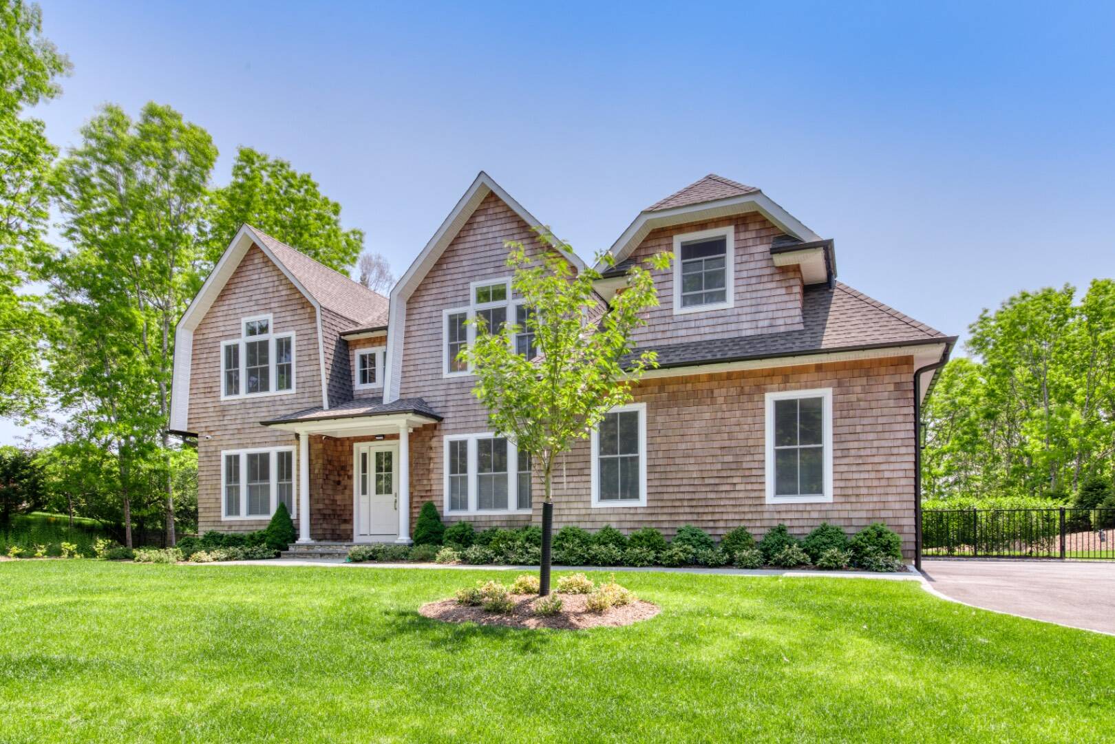 a front view of a house with a yard