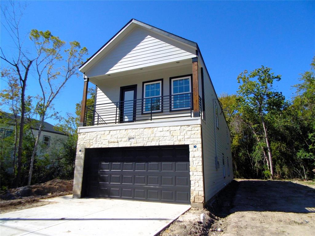 a front view of a house with a garage