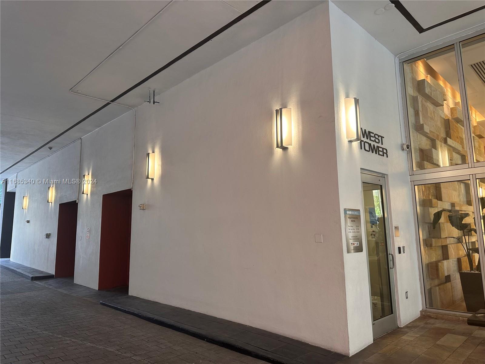 a view of a hallway with windows