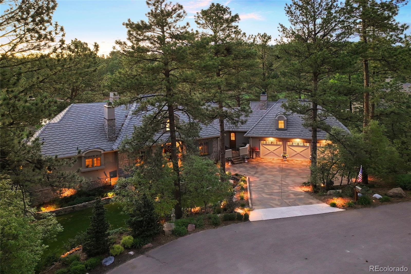 an aerial view of a house with a yard basket ball court and outdoor seating