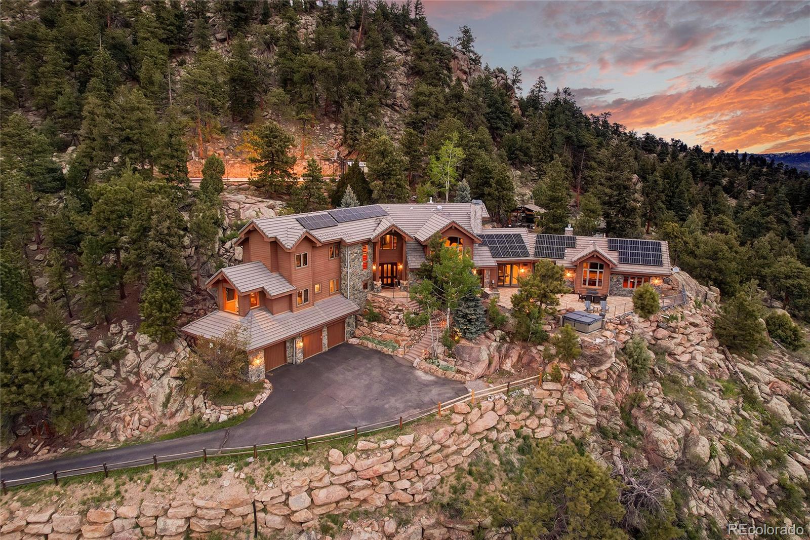 an aerial view of a house with a yard basket ball court and outdoor seating