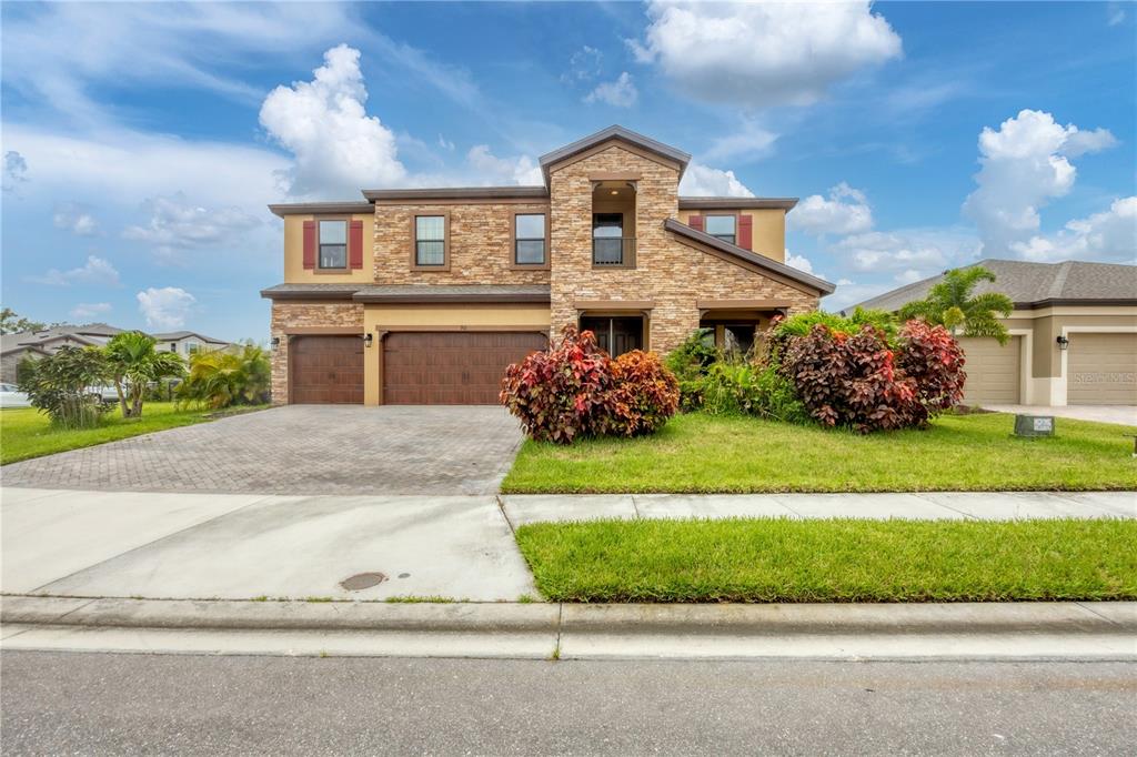 a front view of a house with a yard