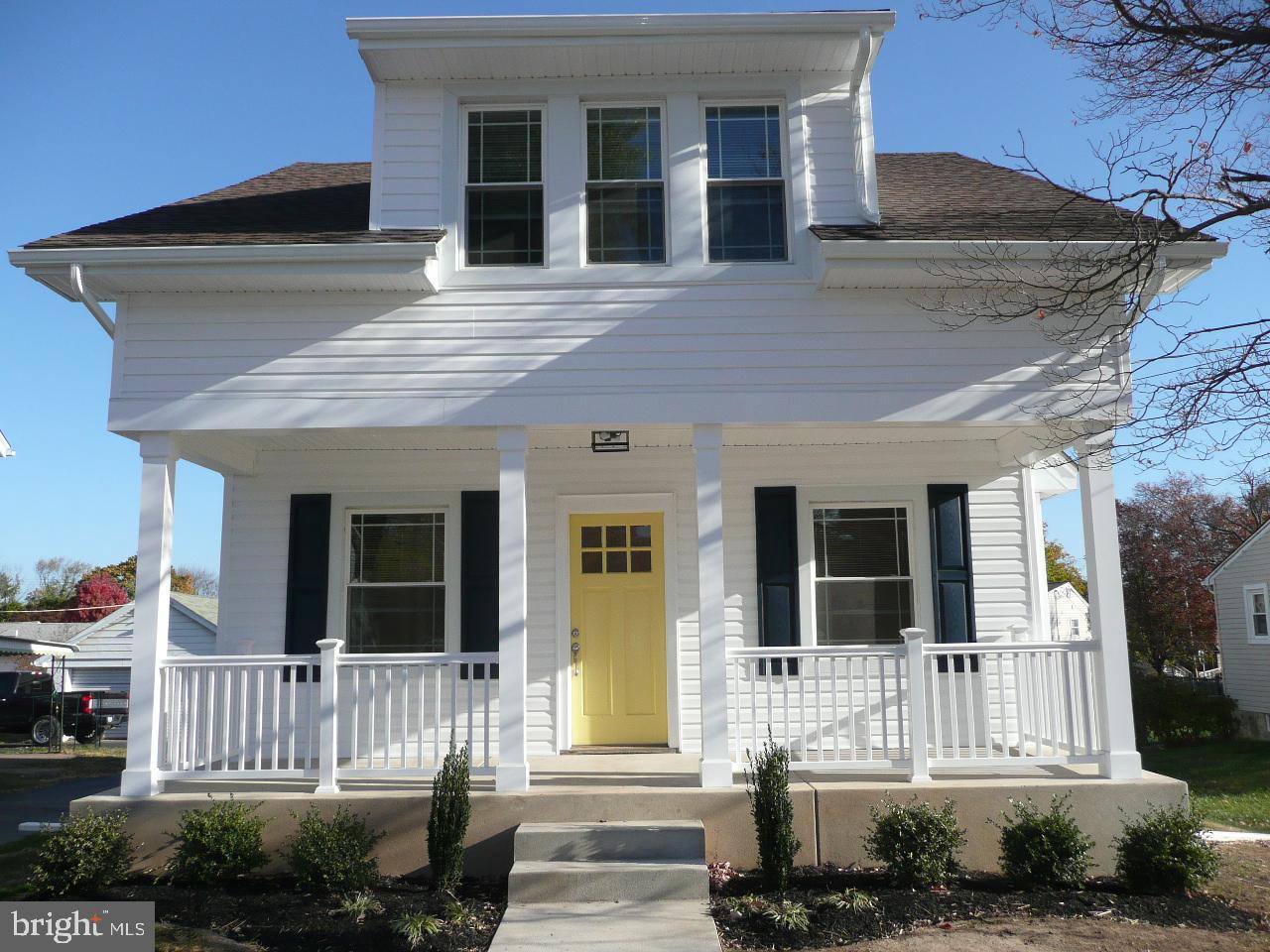 a front view of a house with a porch