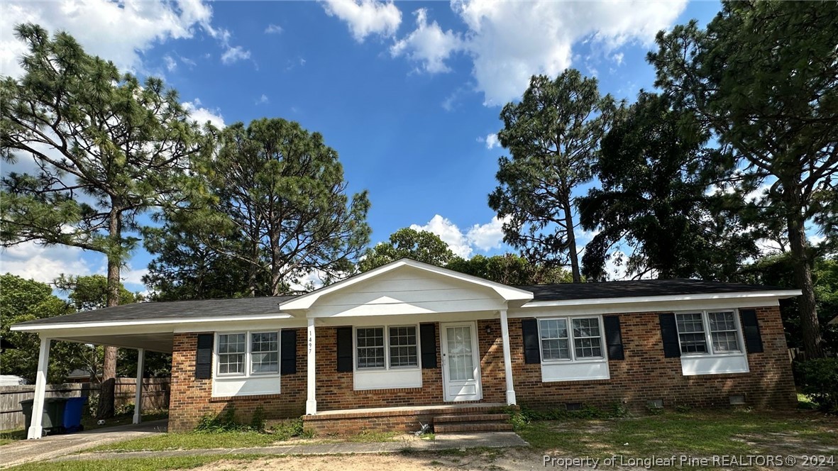 front view of a house with a yard