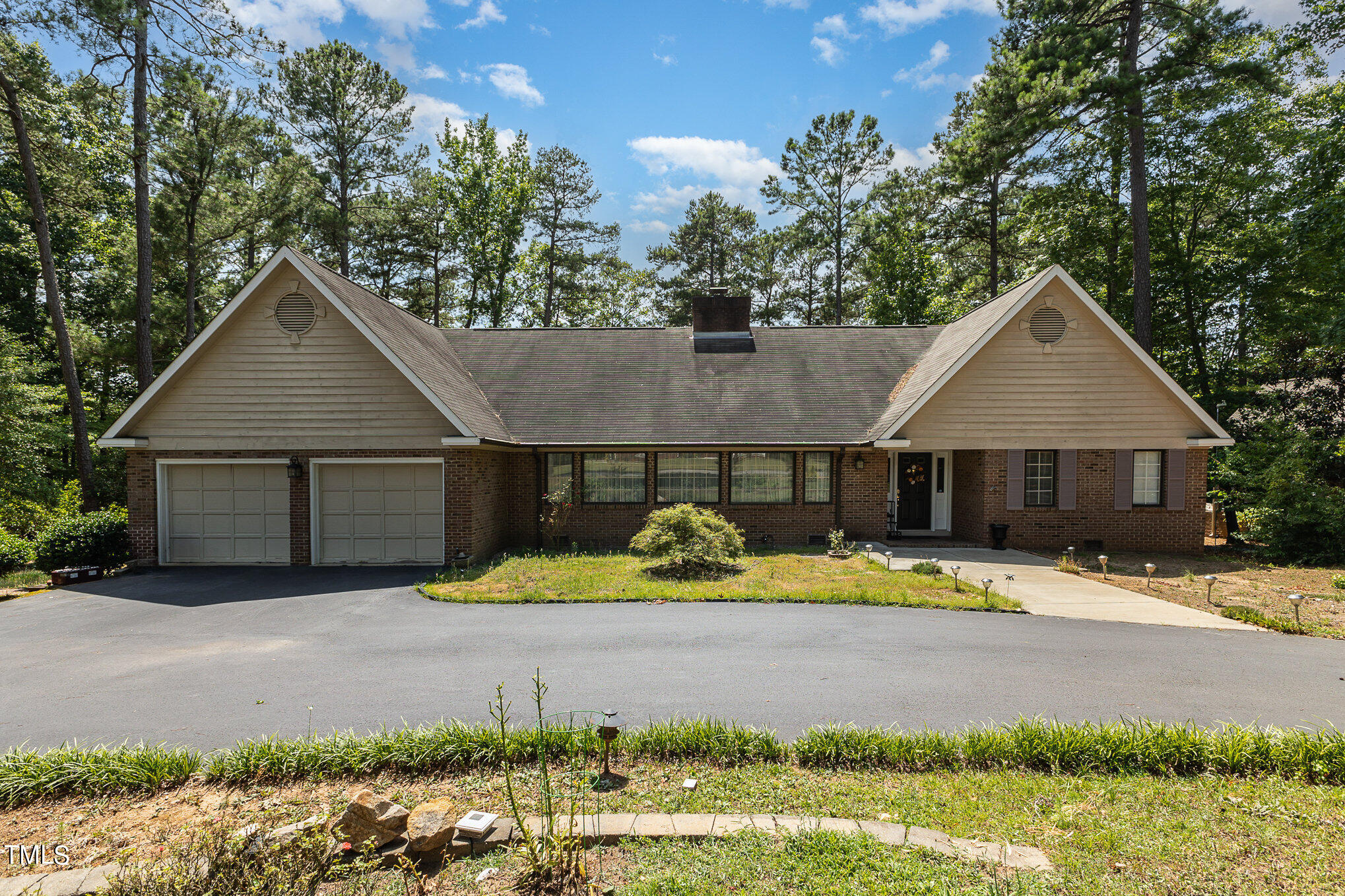 a view of house with yard outdoor space and seating area