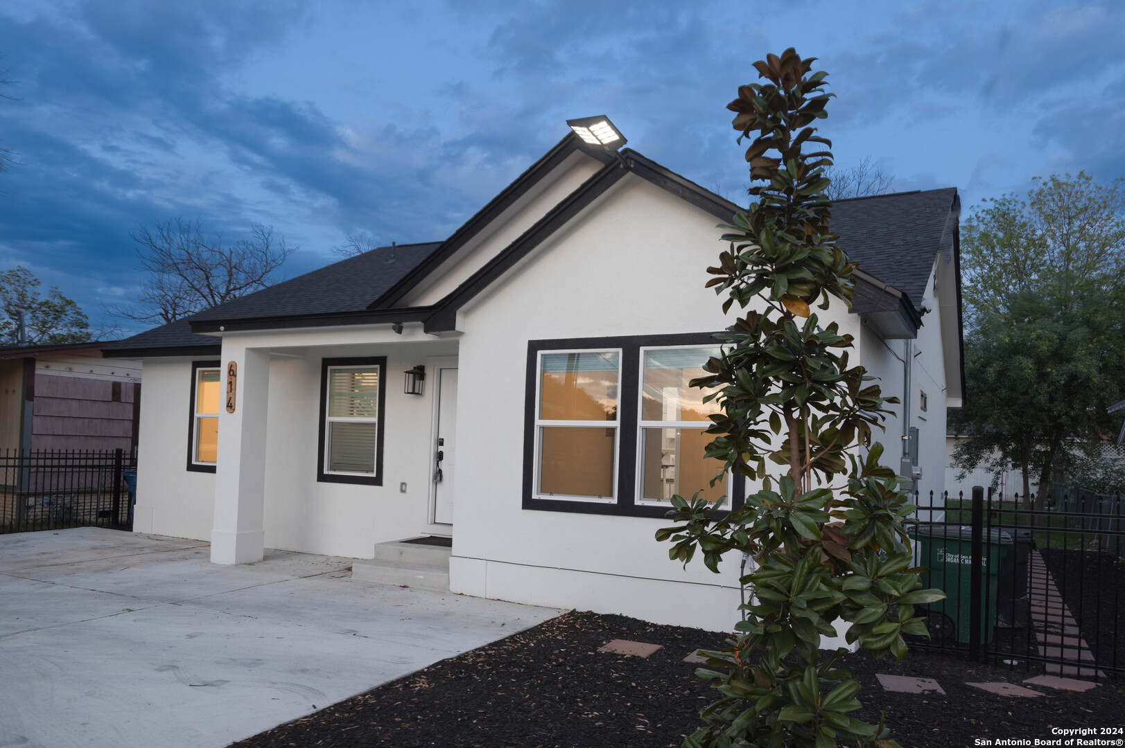 a front view of a house with a garage