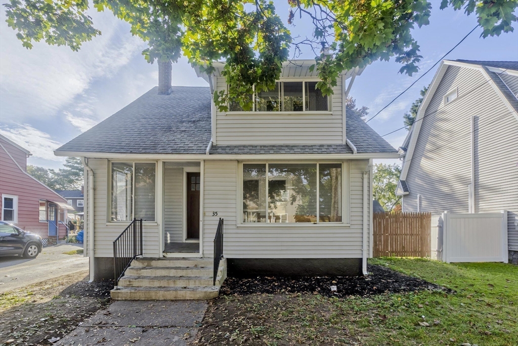 a view of a house with a yard