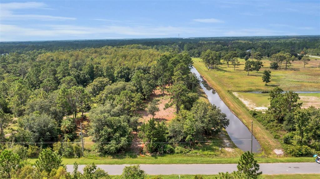 a view of a lake with a yard