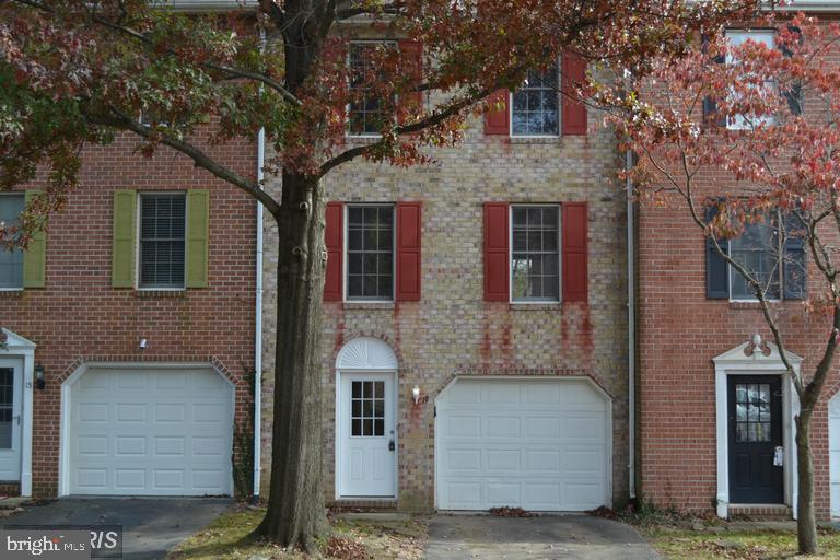 a front view of a house with yard