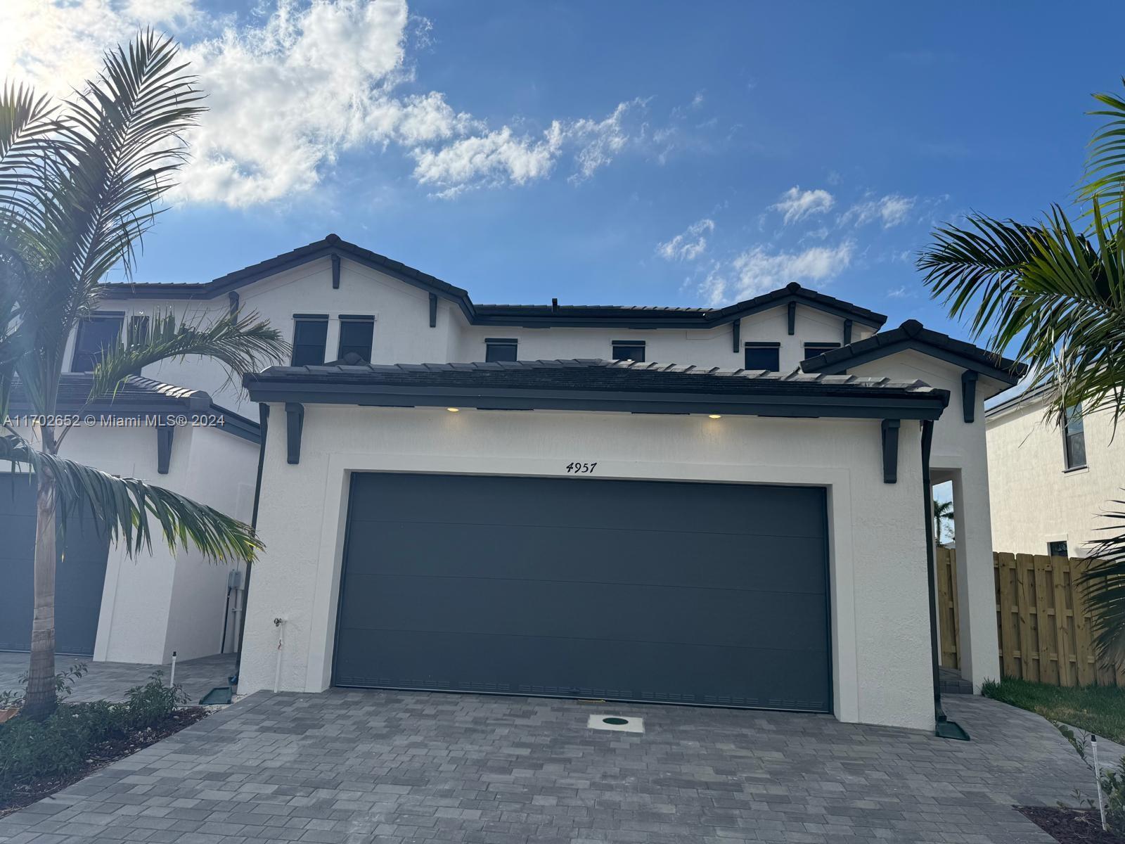 a front view of a house with a garage