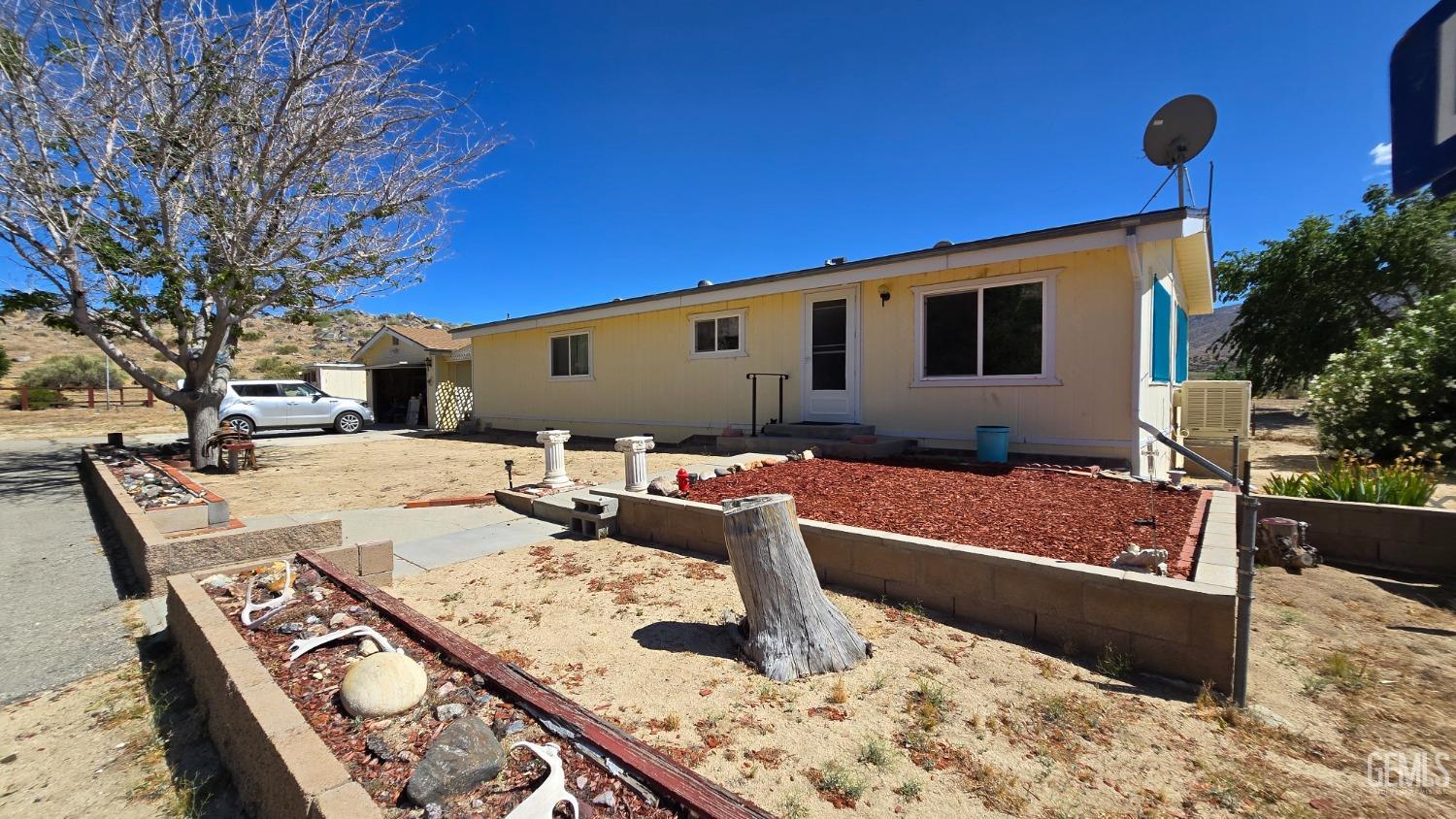 a front view of a house with outdoor seating