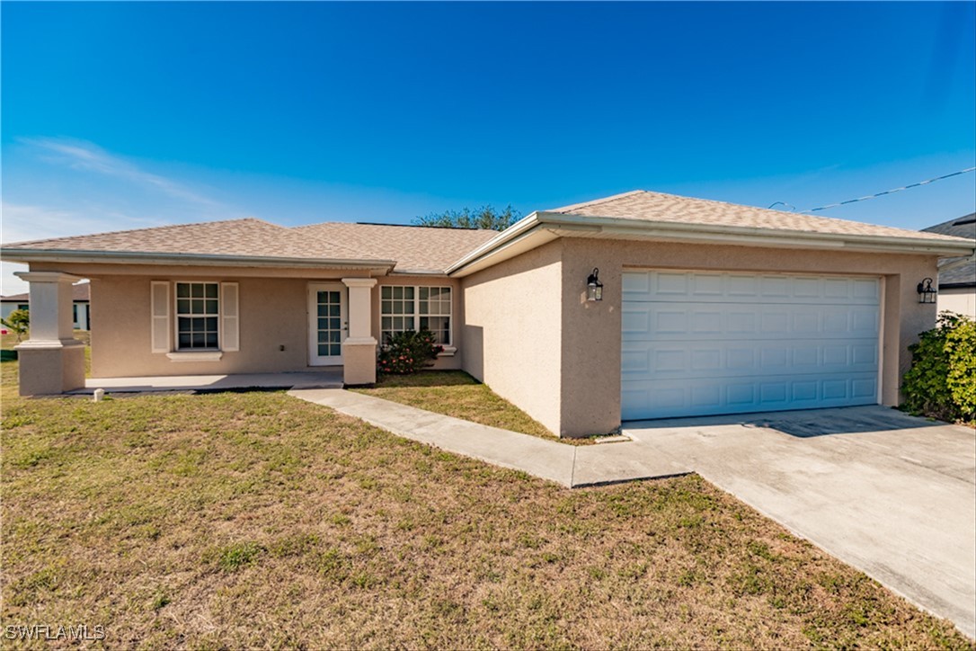 a front view of a house with a yard