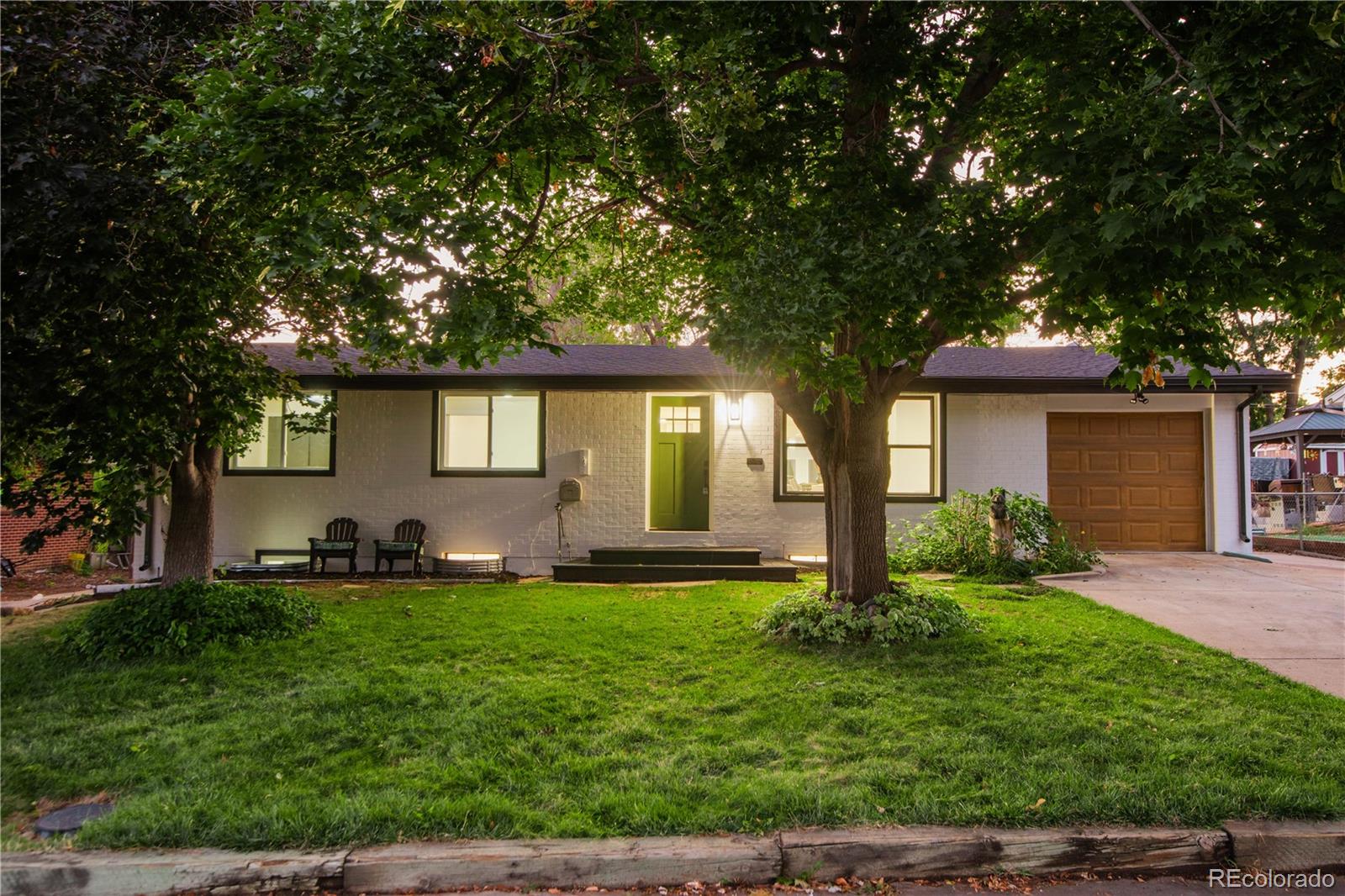 front view of a house with a yard