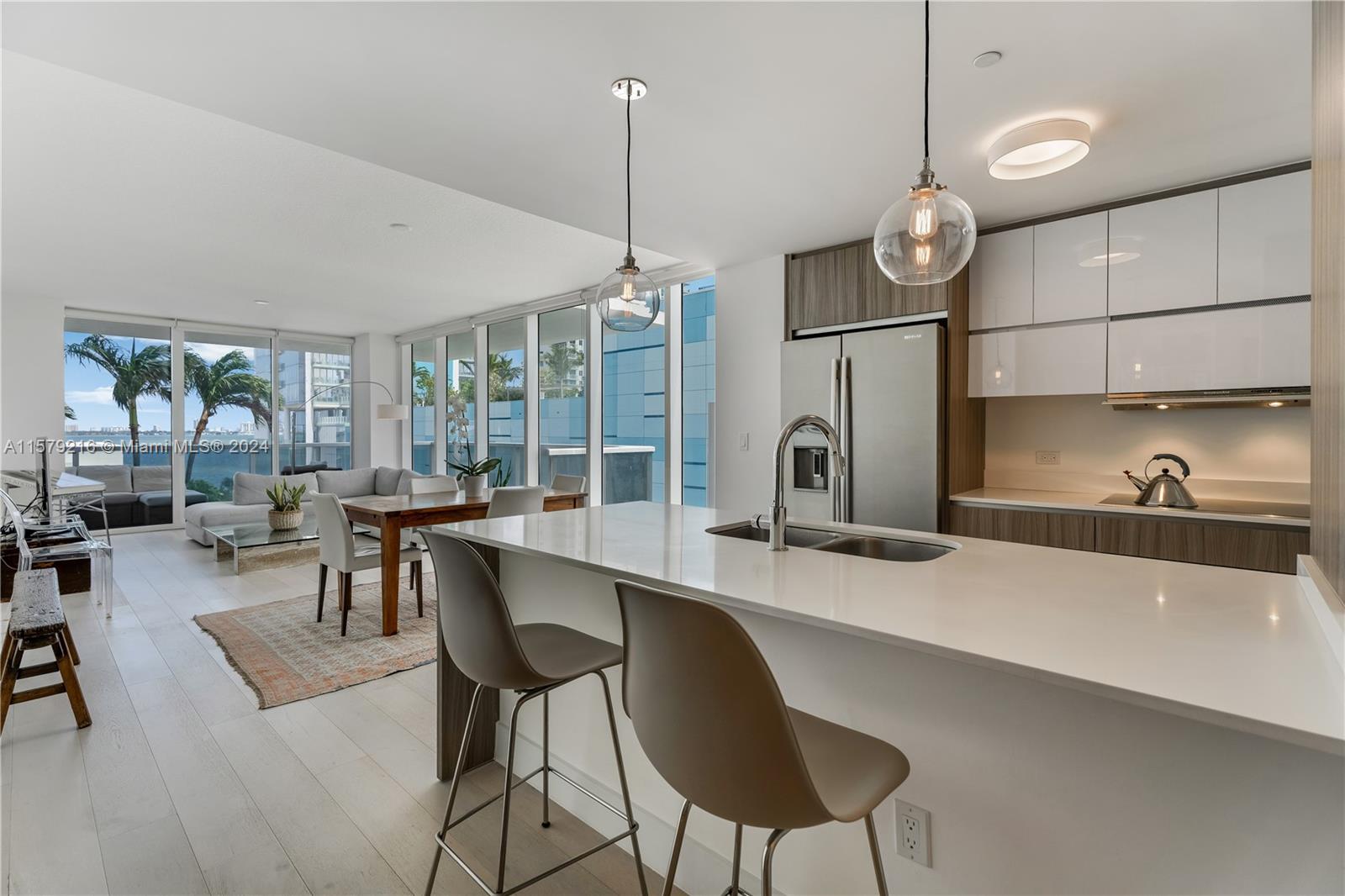 a kitchen with a counter space cabinets and appliances