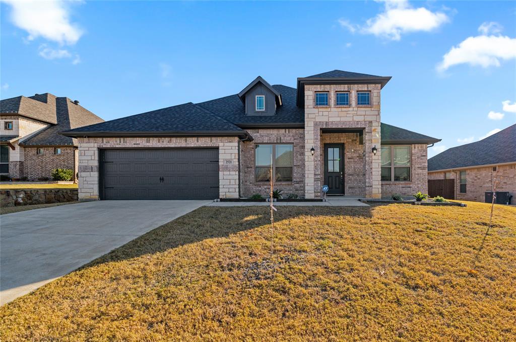 a front view of a house with a yard