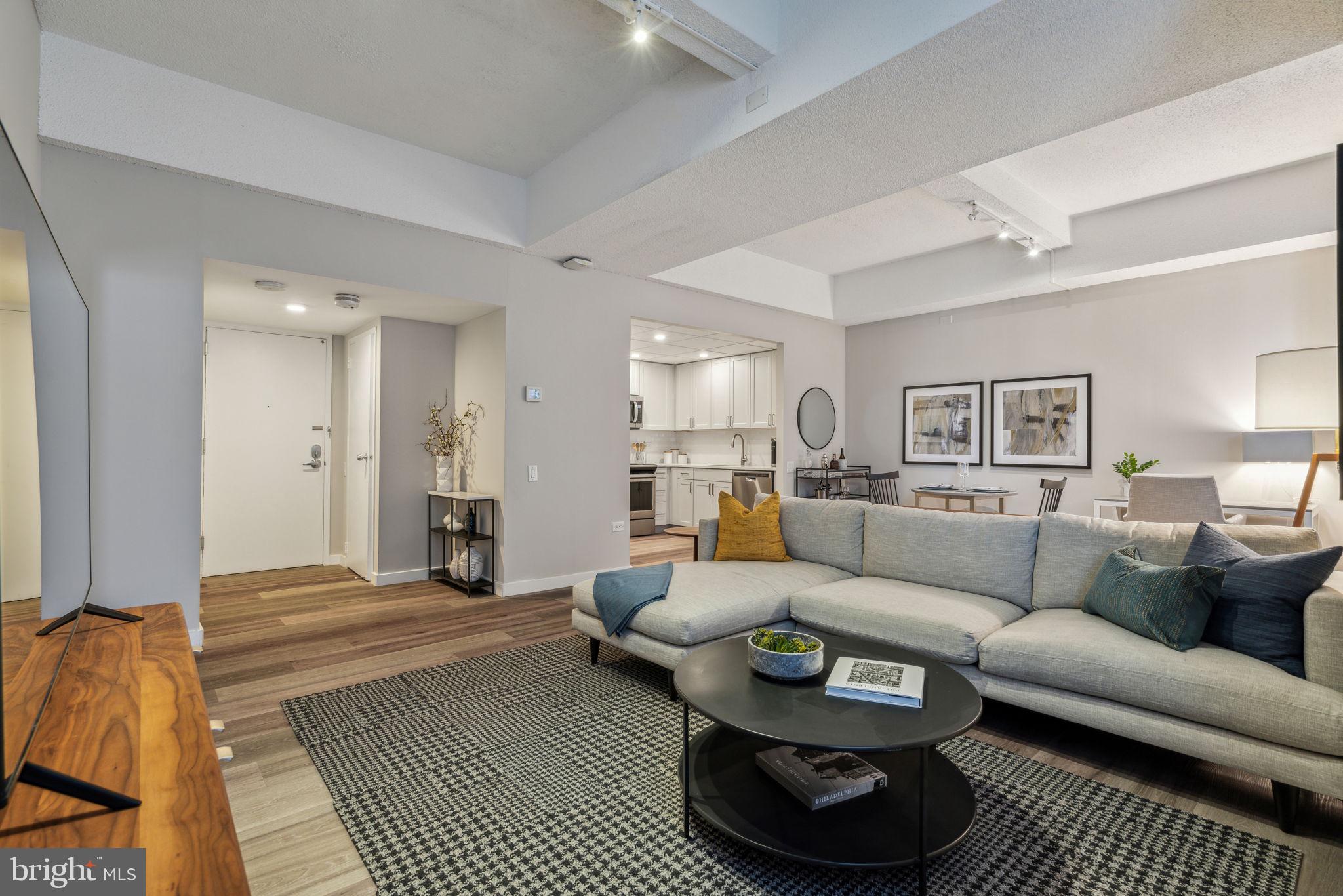 a living room with furniture and a rug