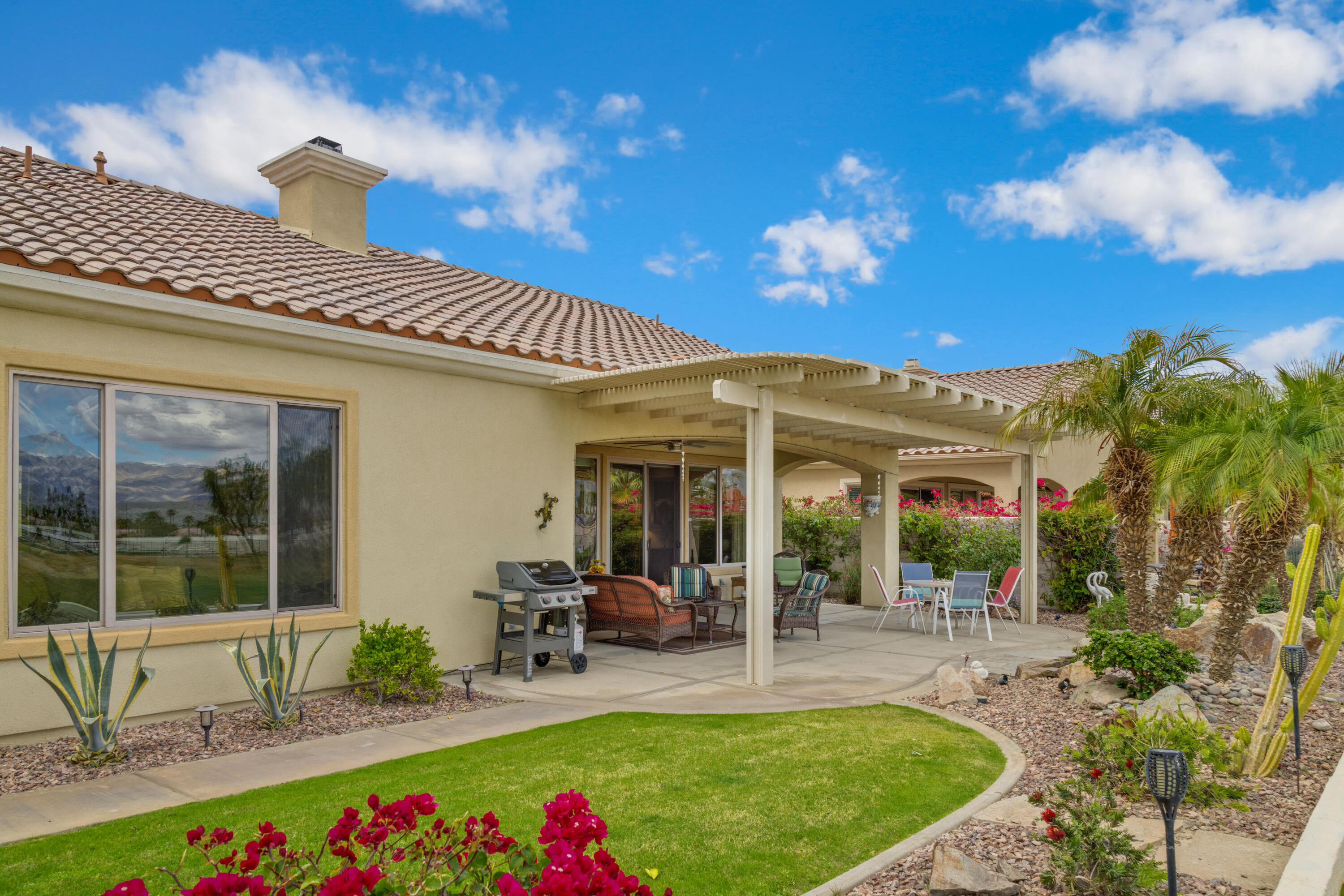 a view of an house with backyard porch and patio