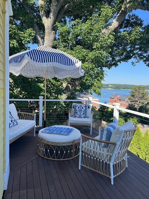 a view of a patio with wooden floor