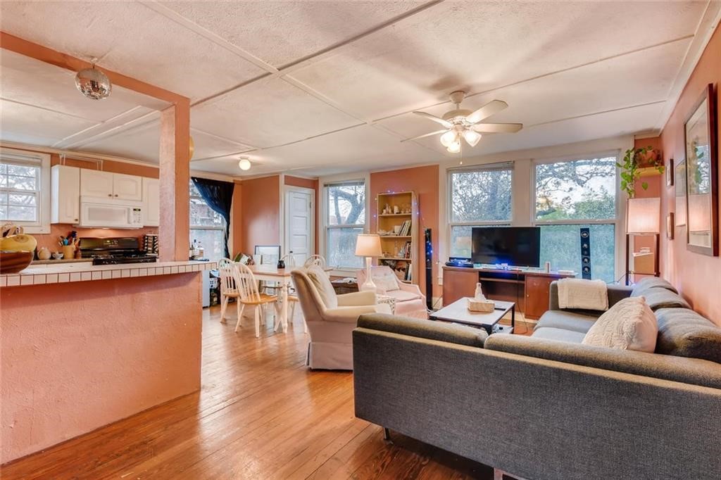 a living room with furniture and a flat screen tv