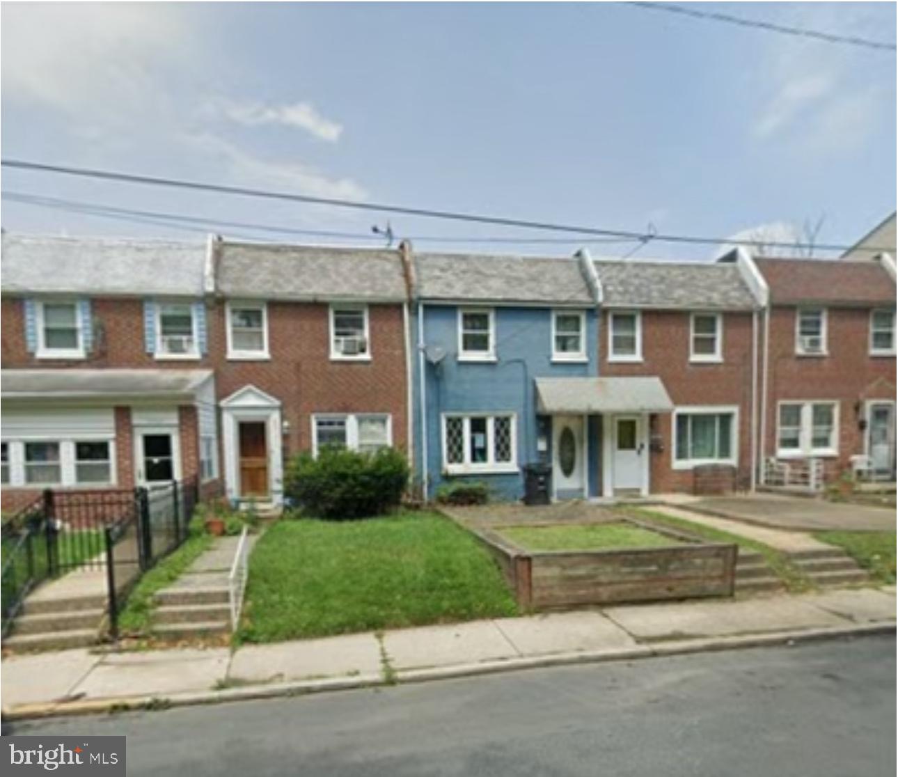 a front view of residential houses with yard