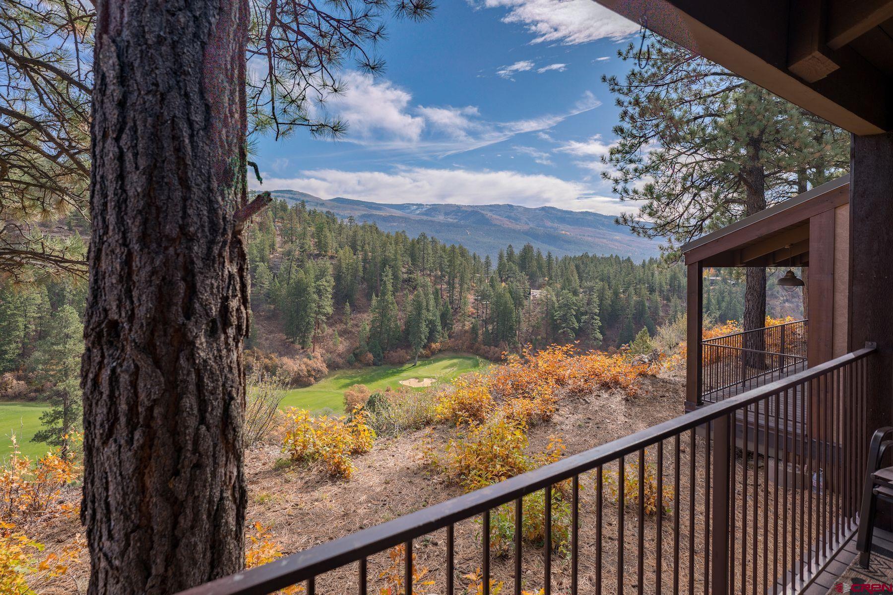 a view of a yard from a balcony