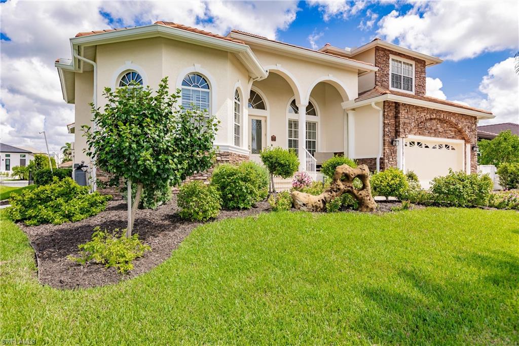 a front view of a house with garden