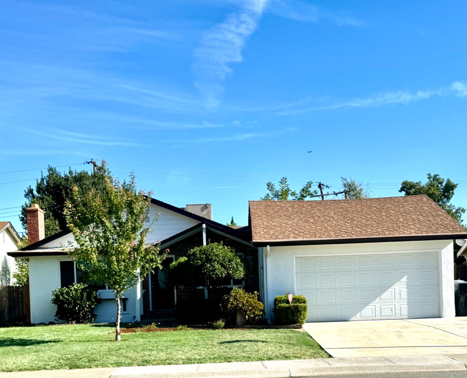 front view of a house with a street