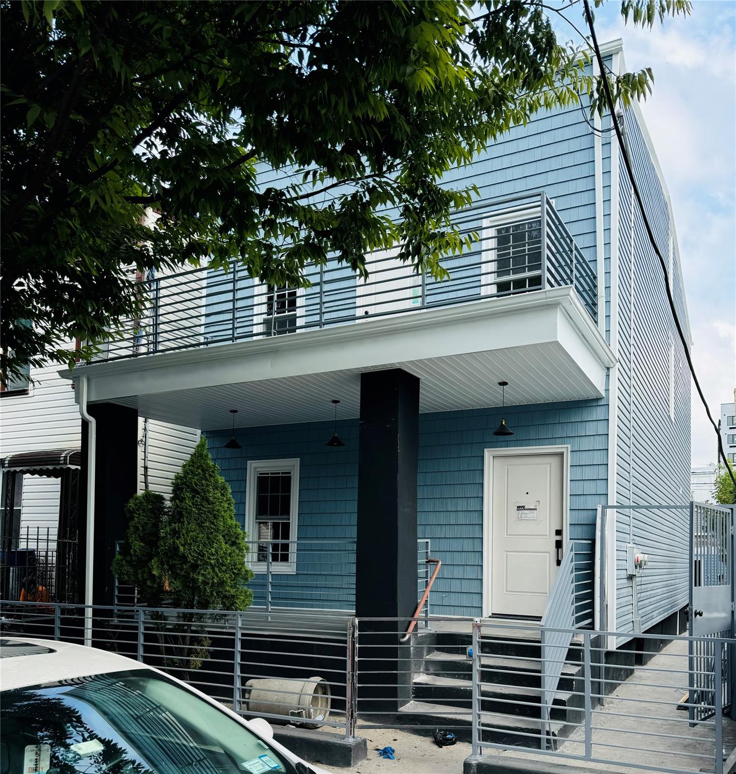 View of front of home with a balcony