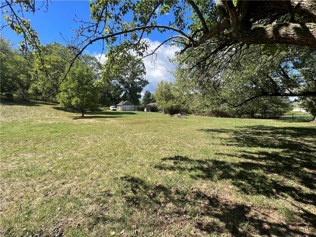 a view of a field with an outdoor space