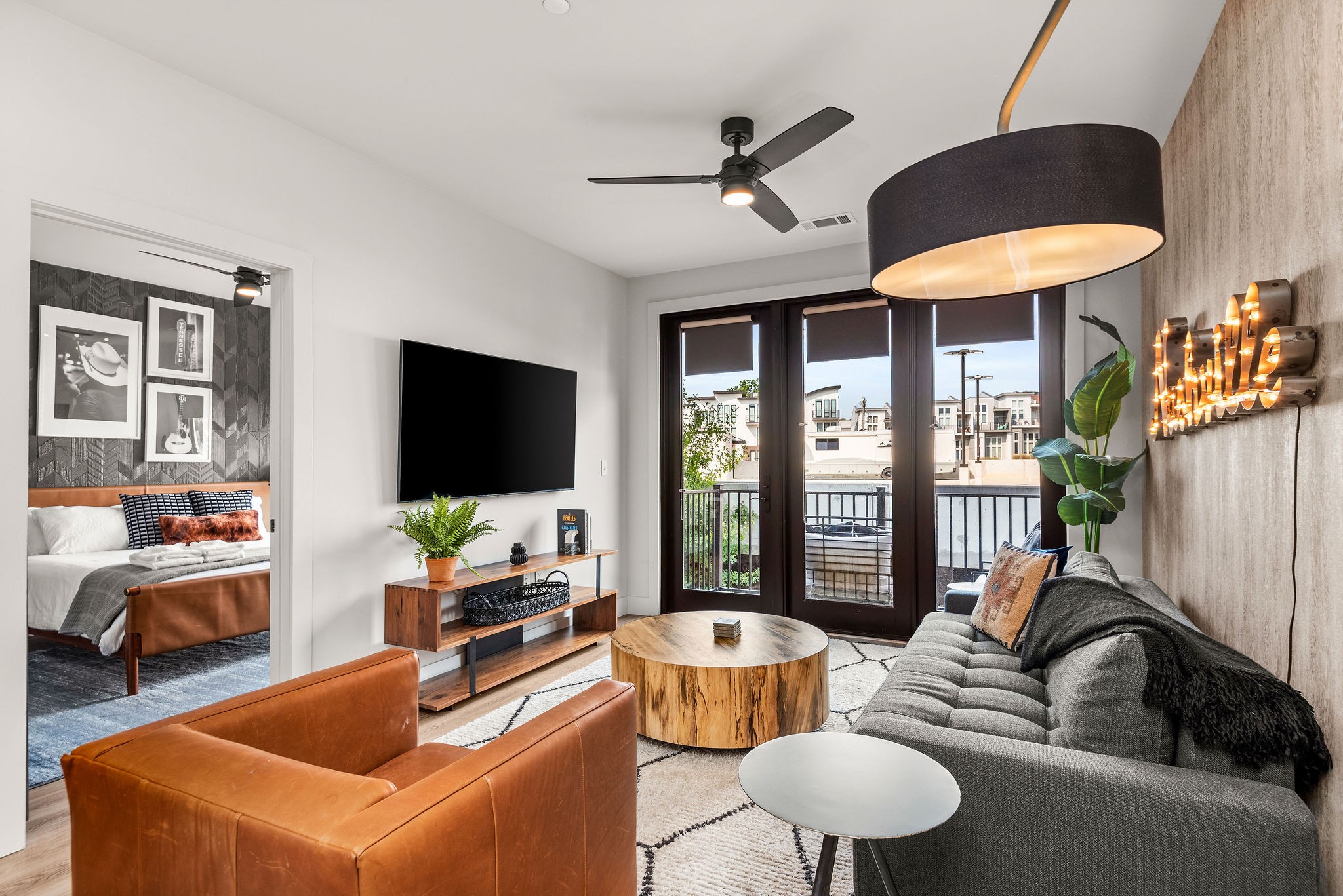 a living room with furniture and a flat screen tv