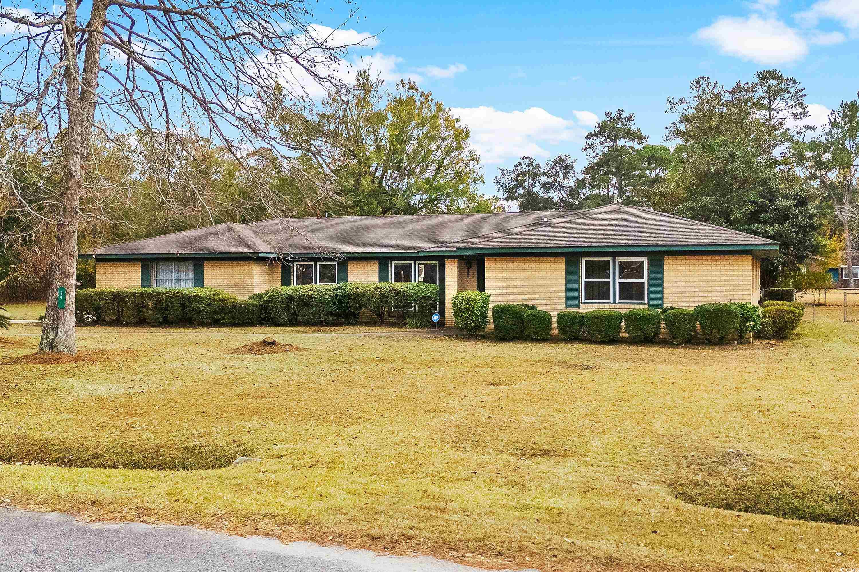 Ranch-style home with a front lawn