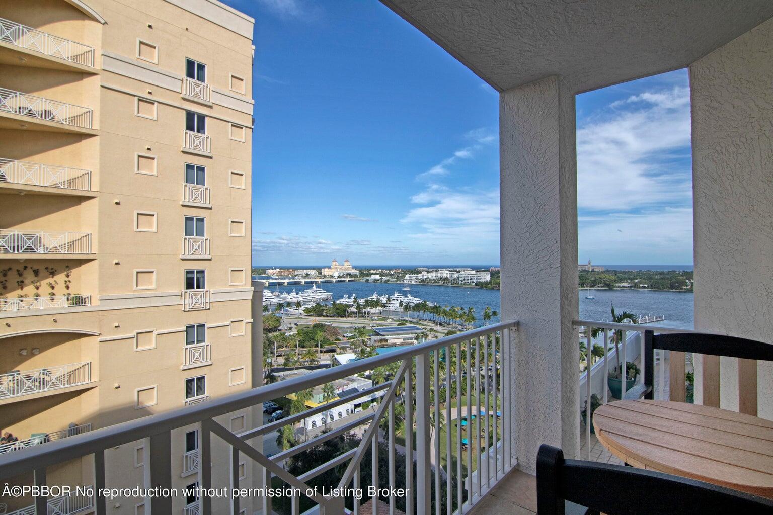 a view of a balcony with wooden floor and city view