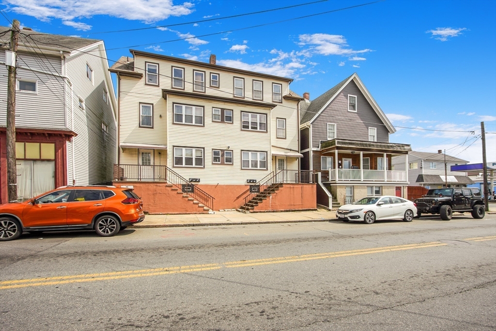 a view of a parked cars in front of a building