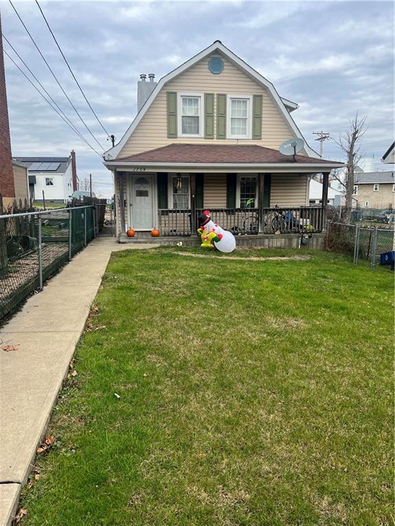 a view of a yard and front view of a house