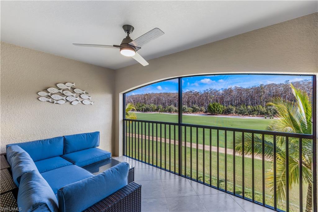 a view of a living room and a floor to ceiling window