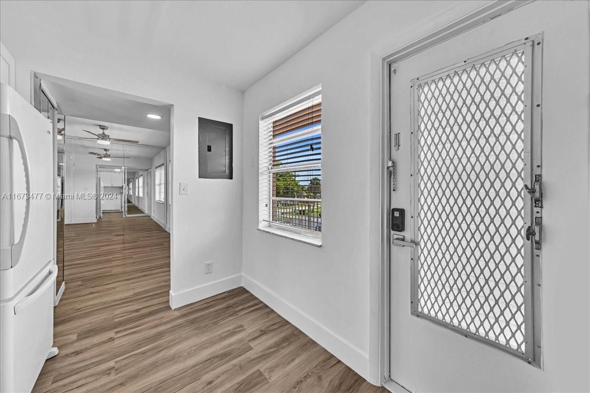 a view of entryway with wooden floor