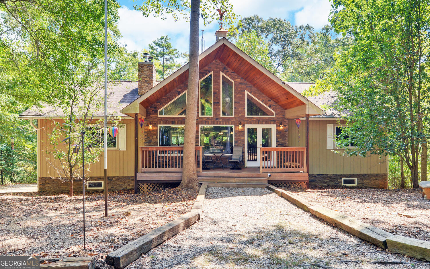 a view of house with a yard