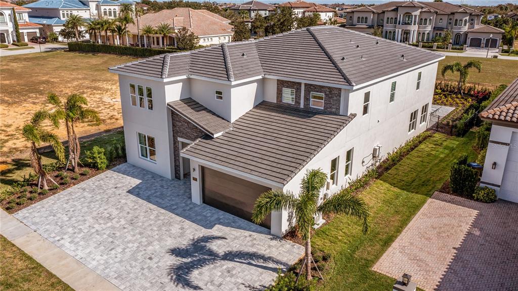 a aerial view of a house with a yard