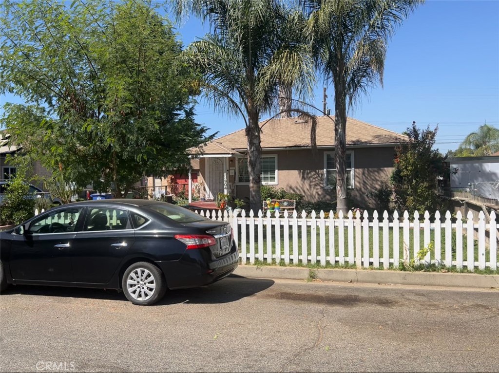 a view of a car parked on the side of the road