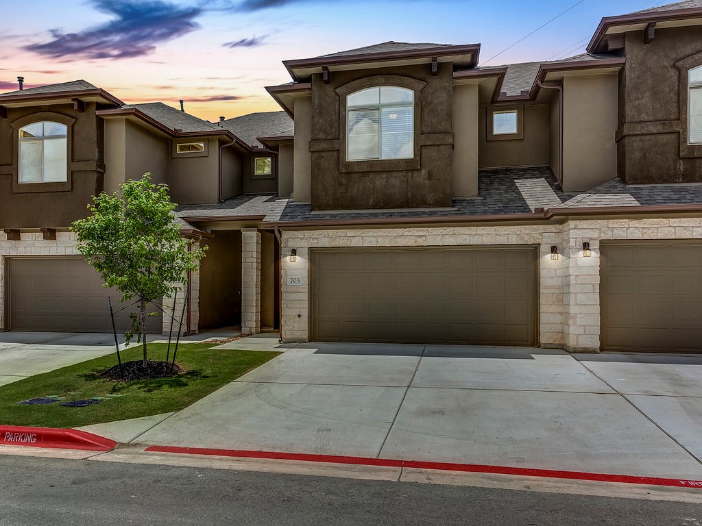 a front view of a house with yard