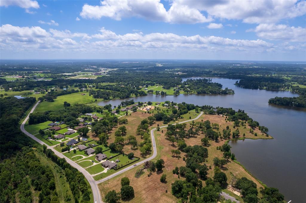 an aerial view of a residential houses with outdoor space