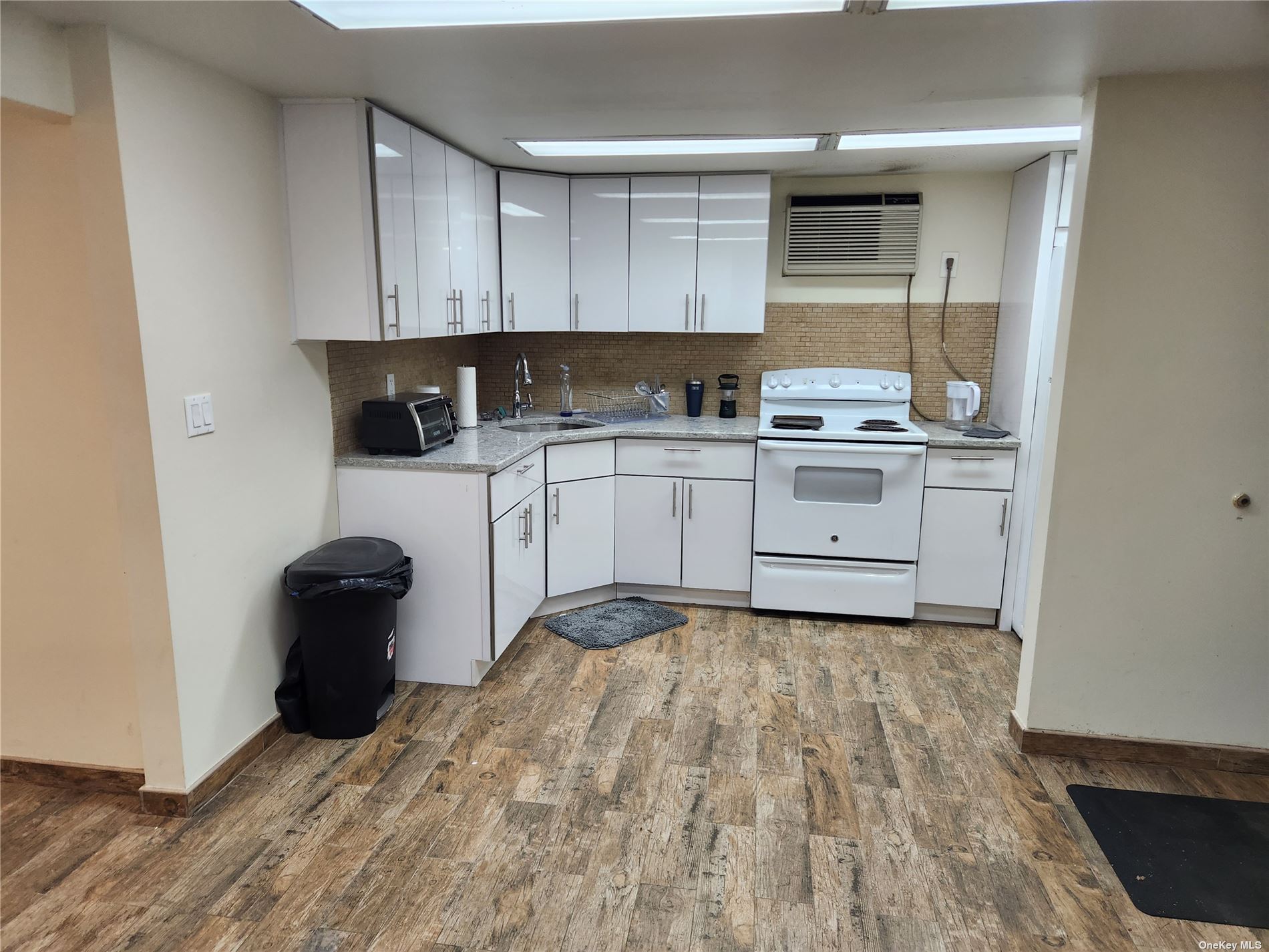 a kitchen with a cabinets and appliances