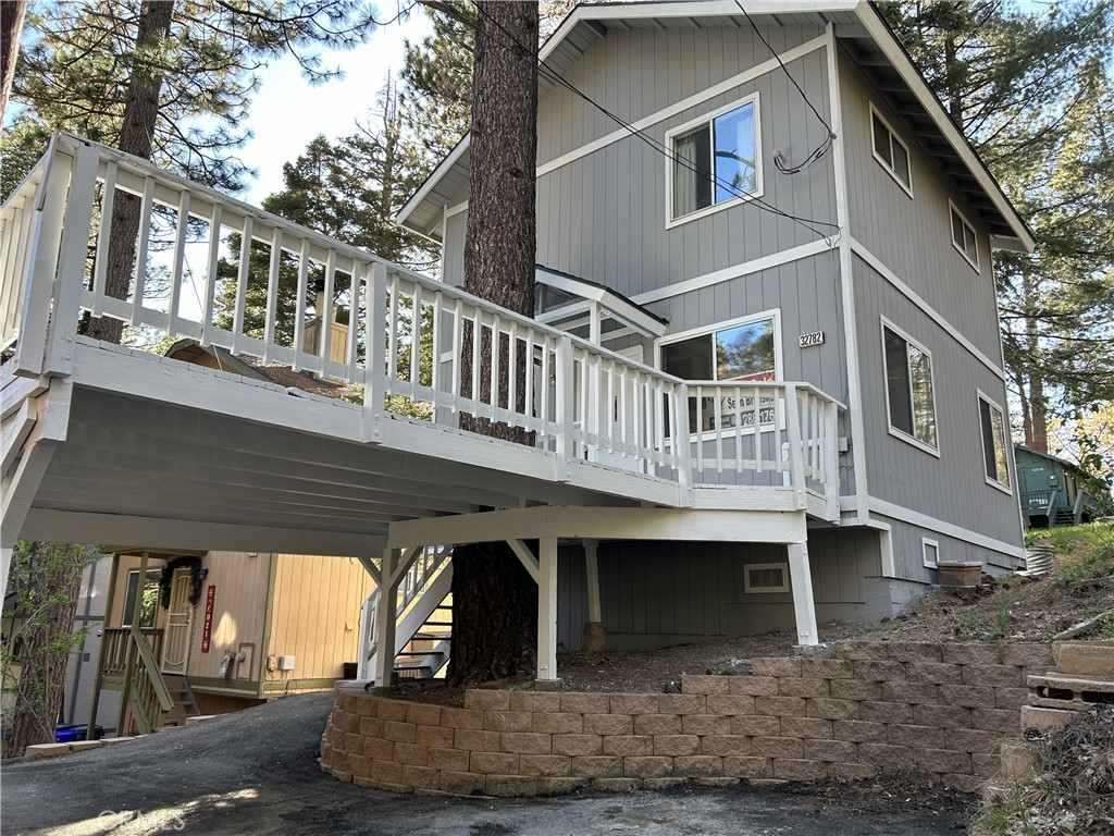 a front view of a house with plants