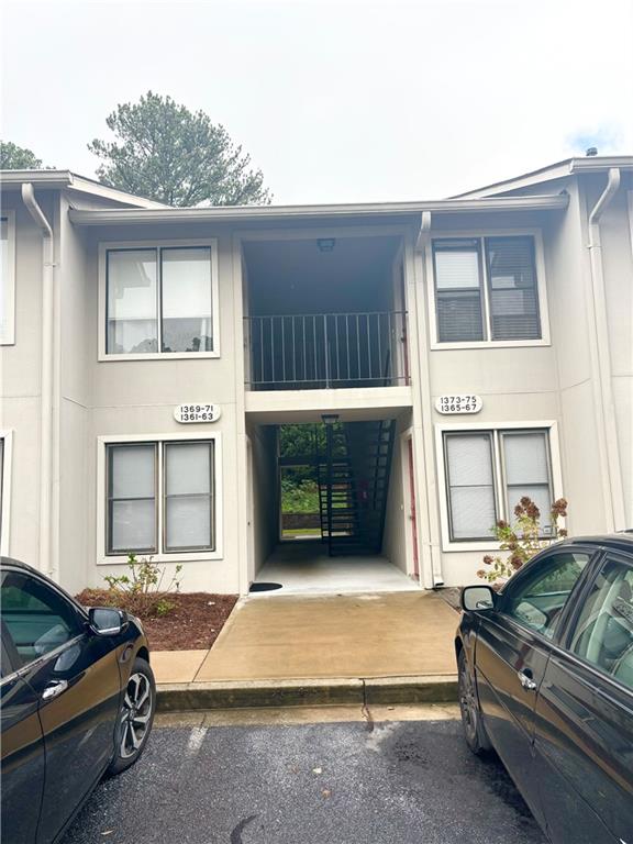 a front view of a house with parking space