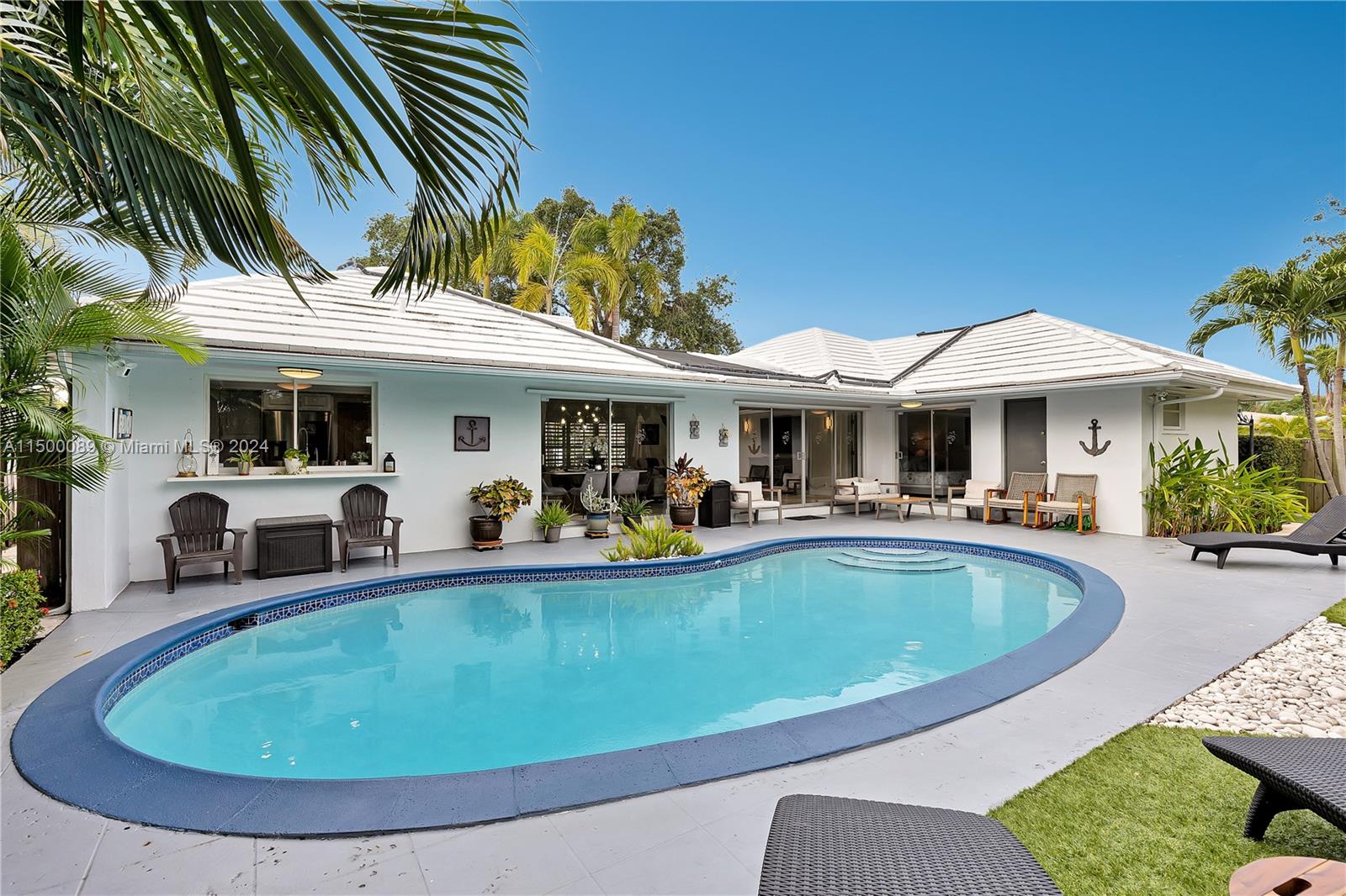 a view of a house with swimming pool and porch