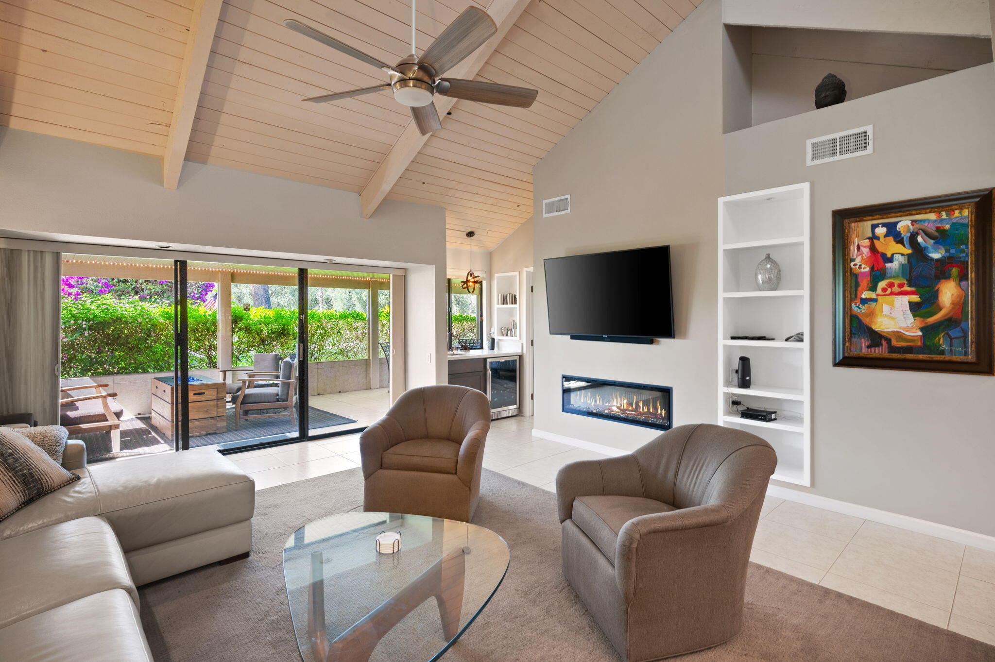 a living room with fireplace furniture and a flat screen tv