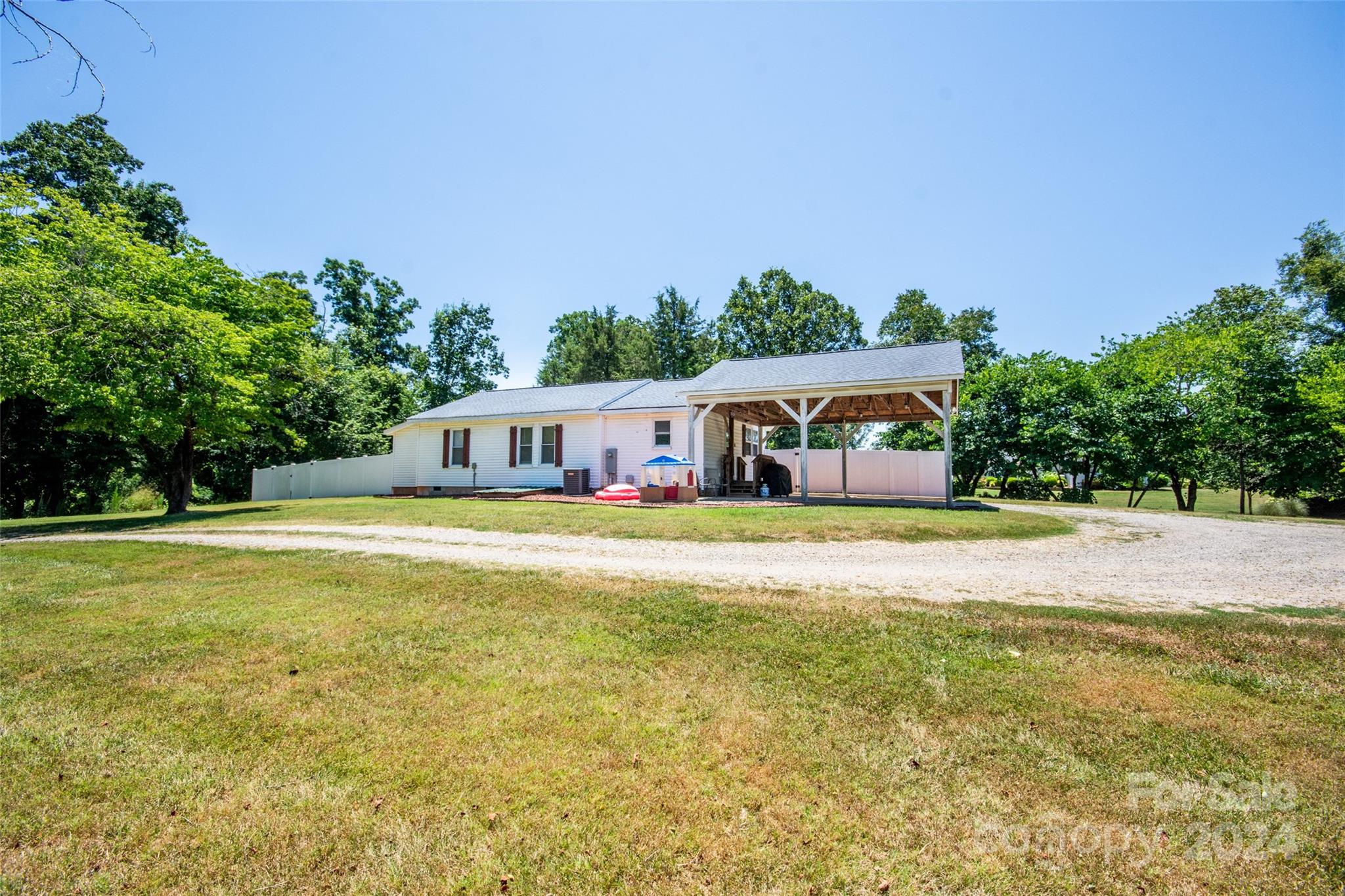 a front view of a house with a big yard