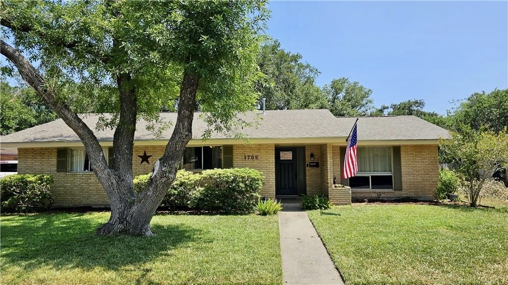 front view of a house with a yard