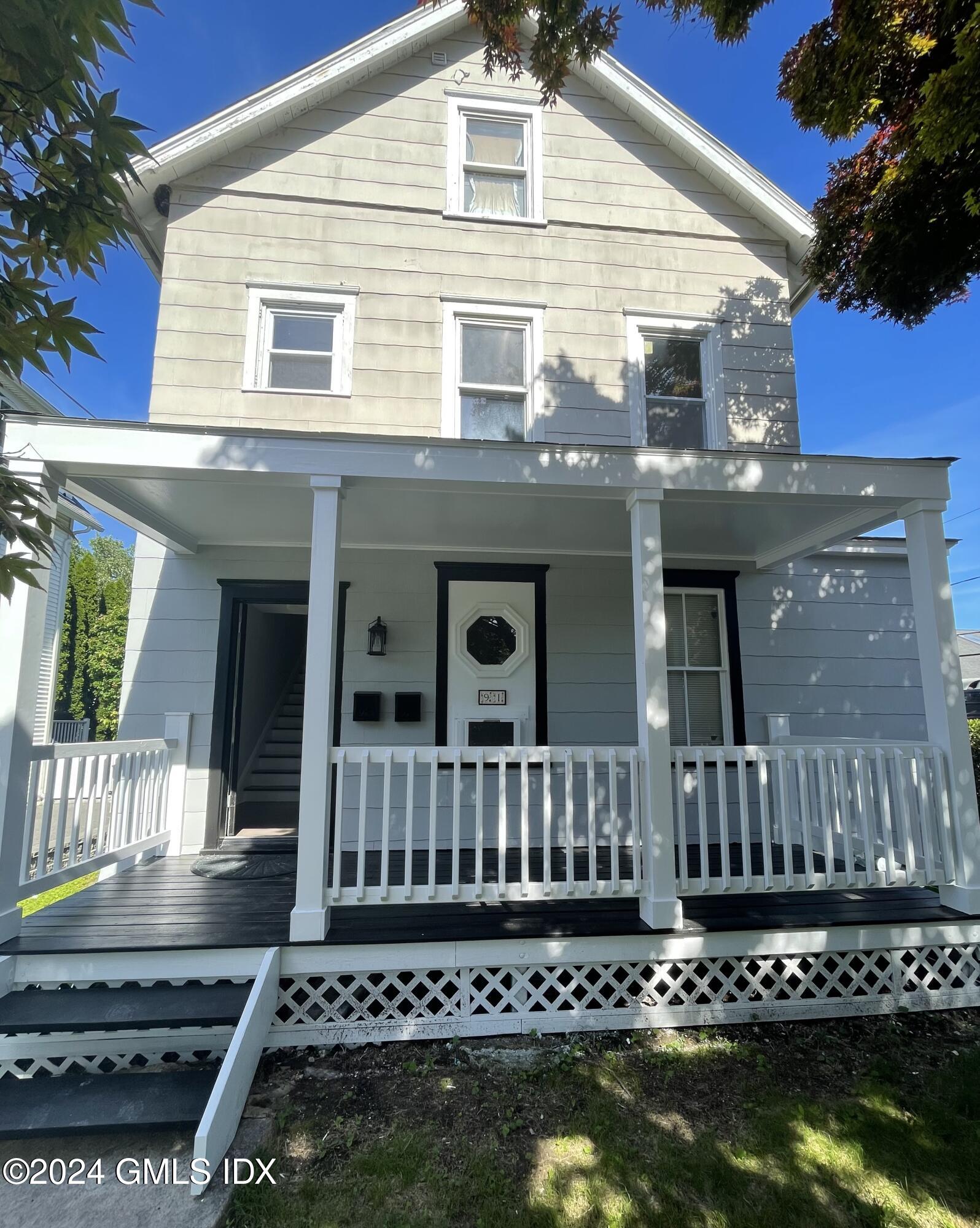 a view of a house with wooden deck