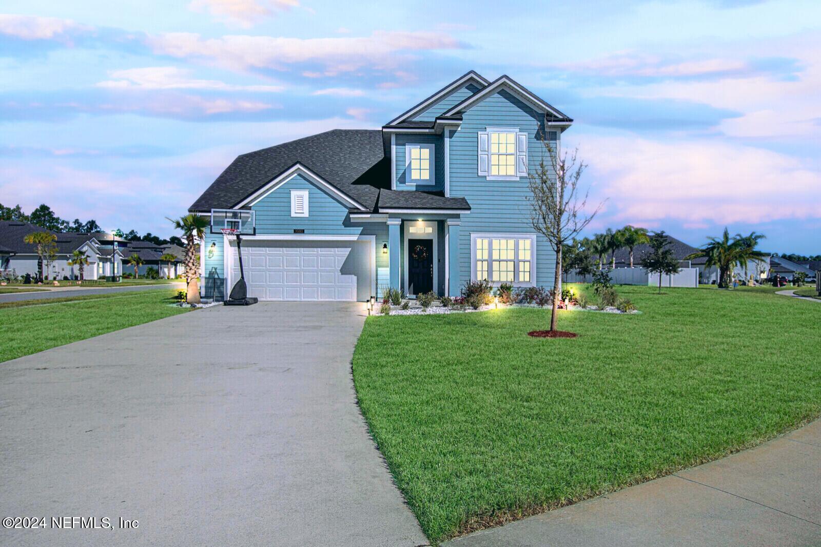 front view of a house with a yard